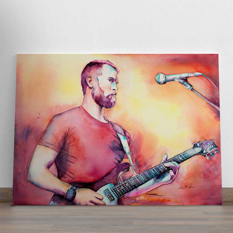 portrait of a guitar player in reds